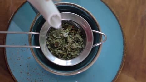 top view of pouring natural herbal tea