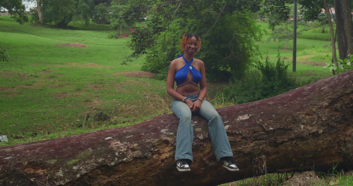 Young African American Woman Stretching Before Workout in Park