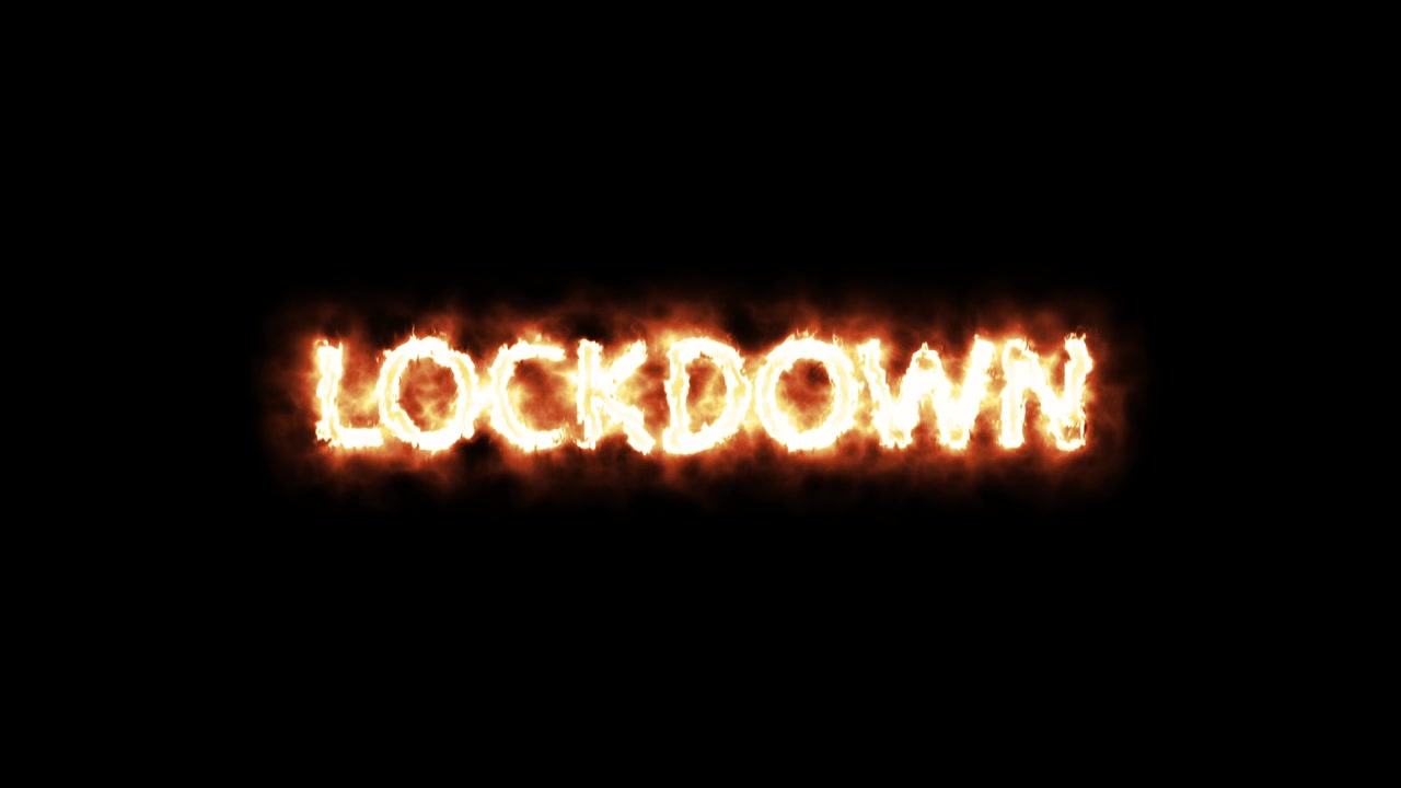 검은 배경에 불로 쓰여진 "LOCKDOWN" 메시지 텍스트 비디오 애니메이션 - 끊김 없는 루프. 반복 애니메이션. 4K. 배경이나 다른 비디오에 애니메이션을 오버레이할 수 있습니다.