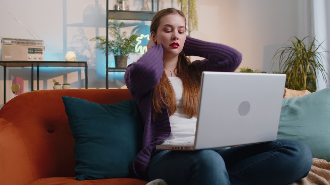 Tired young woman freelancer use laptop suffering from headache problem tension and migraine stress