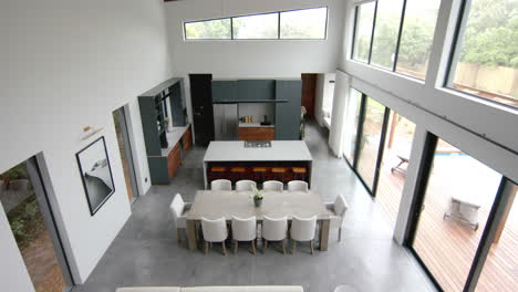 high angle view of open plan living room, dining room and kitchen, copy space, slow motion