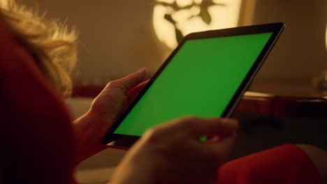 Airplane-passenger-holding-tablet-mockup-in-hands-closeup.-Woman-browsing-web