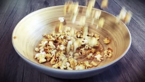 dropping popcorn in bowl