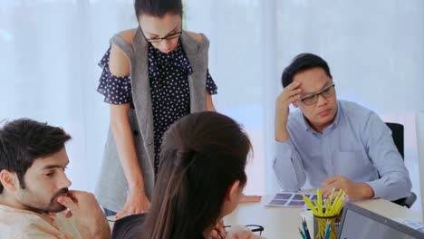 unhappy business people in group meeting after project failure.