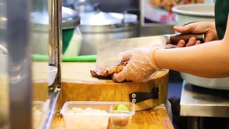 chef slicing ingredients on a cutting board