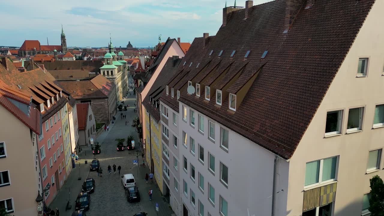 4K Aerial Drone Video of Copper-clad Cupolas, Church Spiers, and Tiled Rooftops on the Skyline of Downtown Nurnberg, Germany