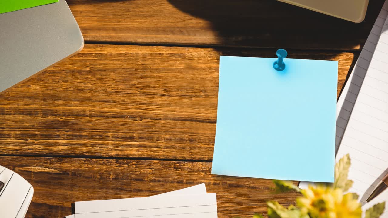 Animation of memo note with copy space over wooden desk