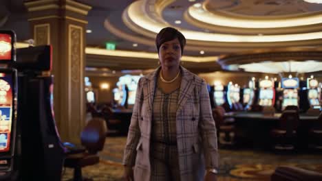 a confident woman strolls through an elegant casino floor, surrounded by slot machines and poker tables, embodying the spirit of high-stakes gambling and entertainment.