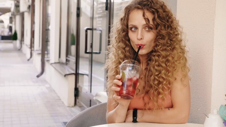 Woman enjoying a drink outdoors