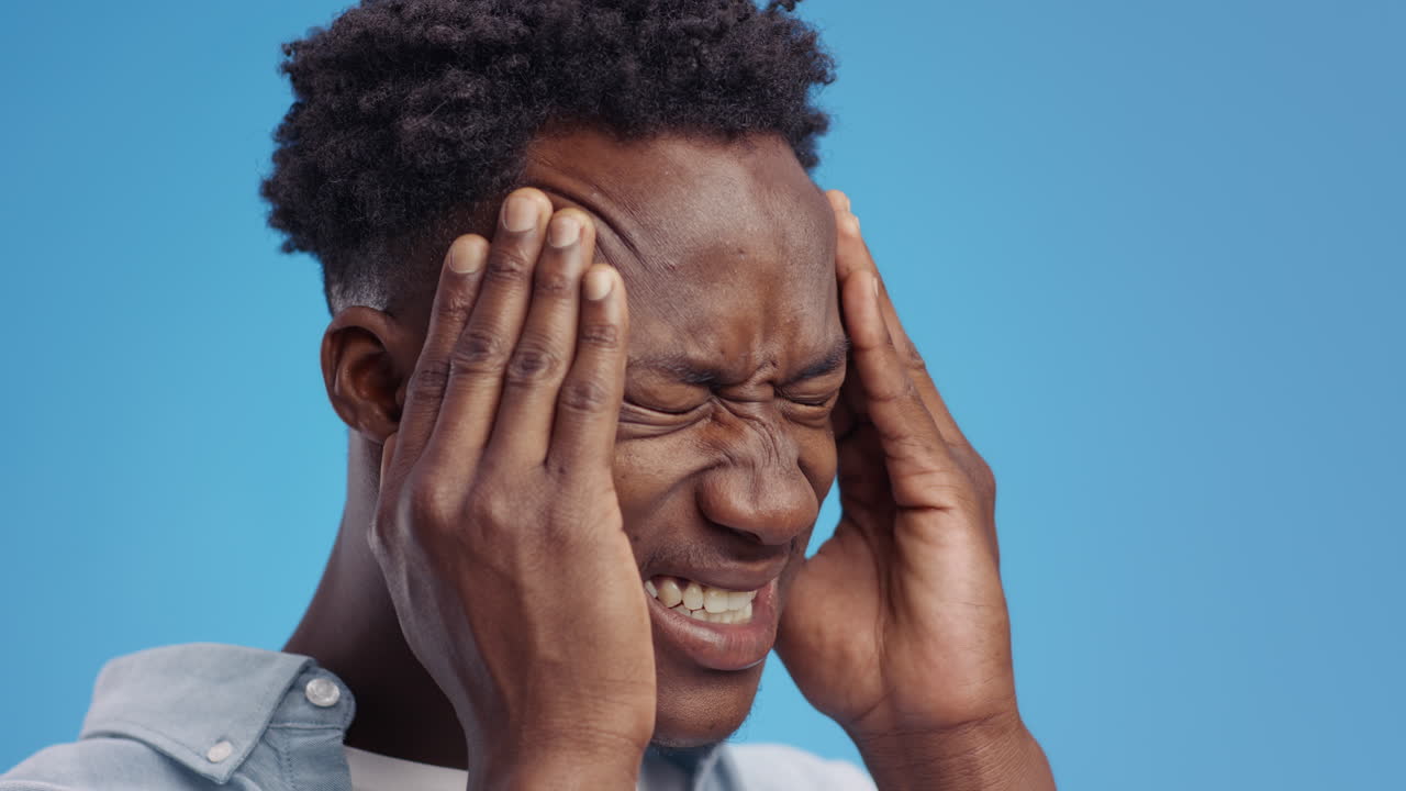 Man experiencing a headache