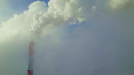 industrial smoke stack and foggy sky