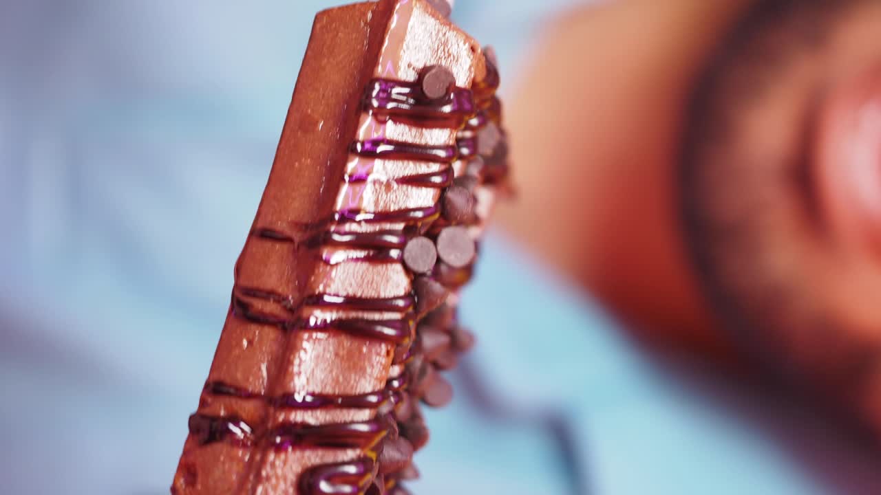 Chocolate dessert and person with glasses