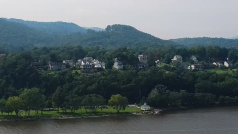 aerial drone video footage of cornwall on hudson in orange county new york, in new york's hudson valley as seen from the hudson river with the appalachian mountains in the background