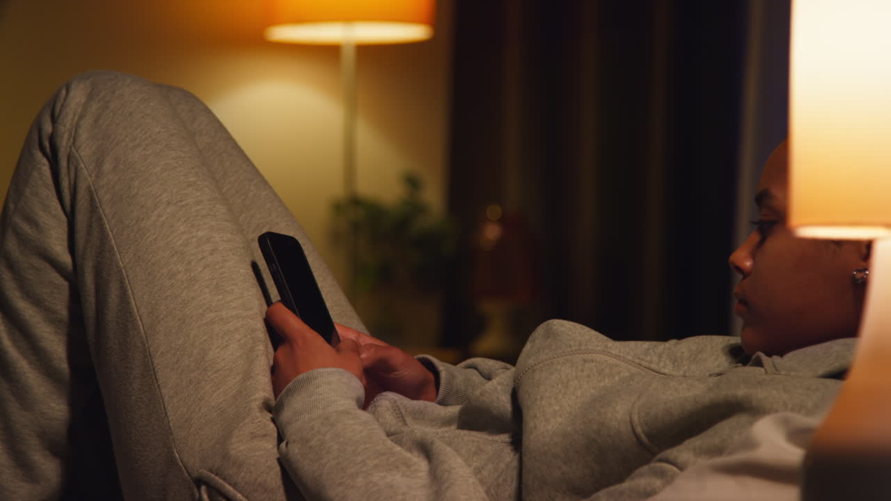 Woman using phone at night