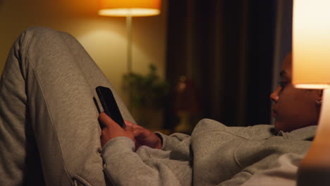 woman using phone at night