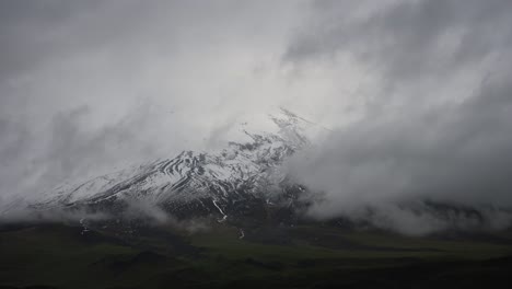 great snow capped volcano forming clouds in the andes of ecuador cotopaxi