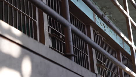 Alcatraz-Prison-Cellhouse,-Closed-Prison-Cells-on-Gallery-in-Block-C,-Low-Angle