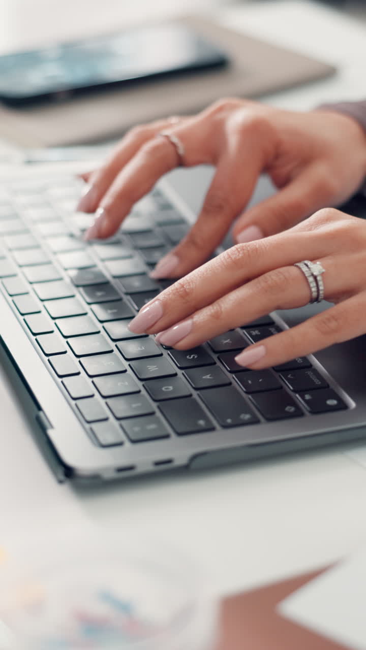Professional Woman's Hands Typing on Laptop Keyboard