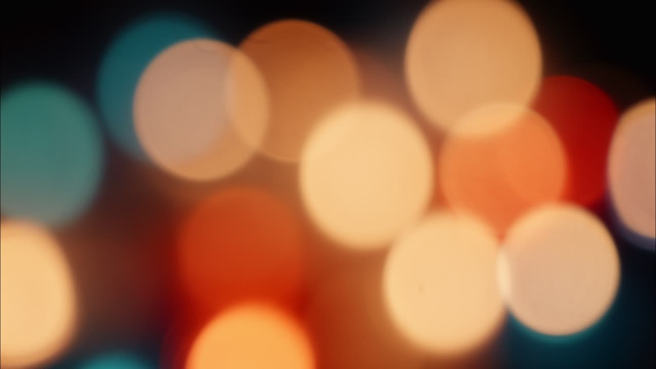 Blurred Colorful Bokeh Lights Shifting on Dark Background