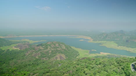 Aliyar-Reservoir-and-dam-under-hazy-sky-due-to-air-pollution,-Coimbatore,-Tamil-Nadu,-South-India