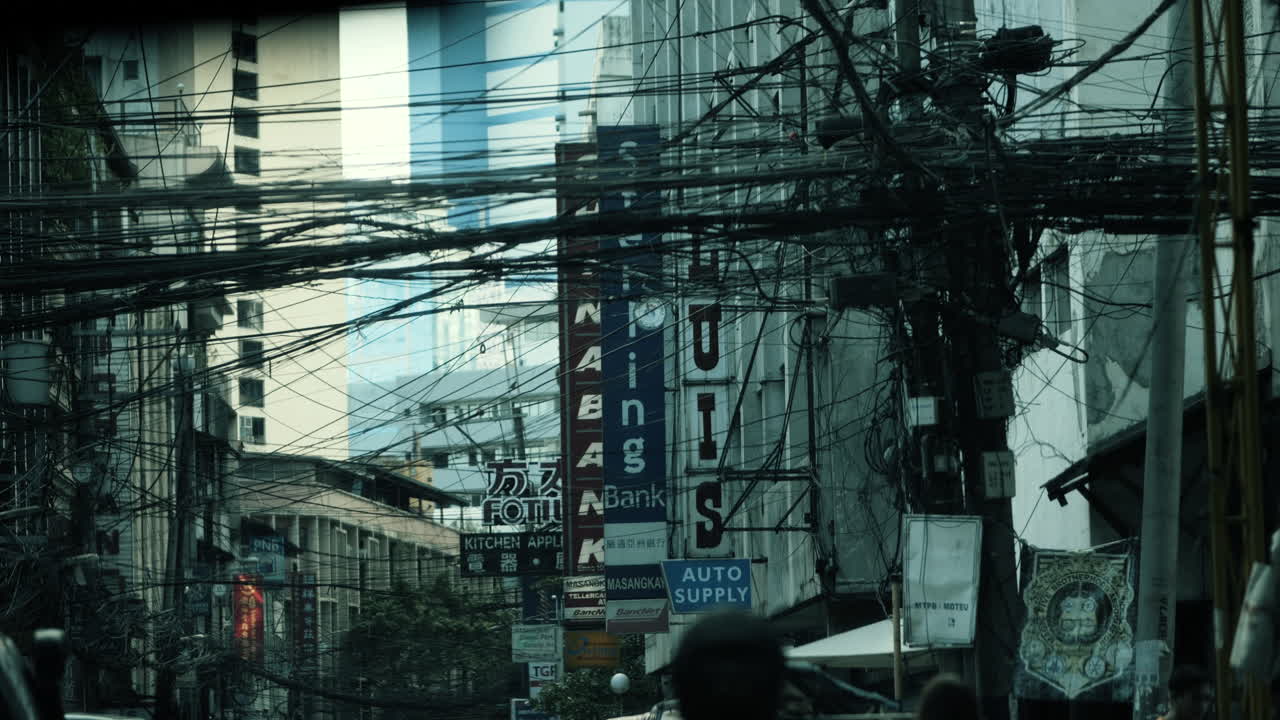 Overcrowded Street Scene with Electrical Wires in Manila