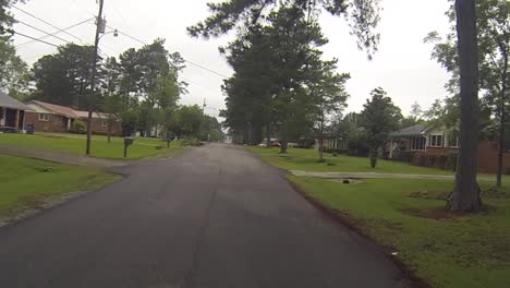 riding a bicycle after a rain in a local neighborhood