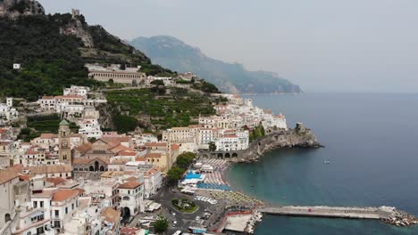 Flyover-Amalfi-Coast,Sunny-Day-Beach-Shore-With-Blue-Sea-and-Church-Drone-Shot-Full-HD-50-Fps