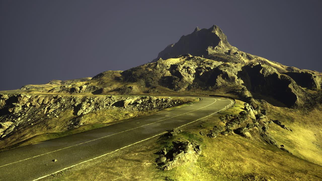 Scenic winding road leading to a mountain summit under evening sky