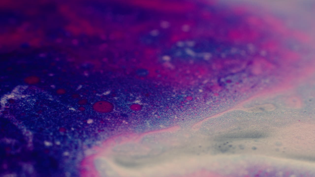 Colourful, organic, liquids macro shots buzzing and flowing