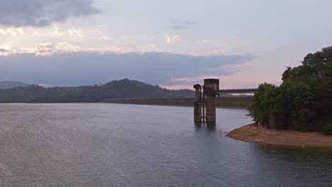 Jet-ski-running-on-waters-of-Presa-de-Hatillo-dam-at-sunset,-Dominican-Republic