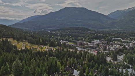 whistler bc canada aerial v1 drone flyover blackcomb park towards the town center capturing picturesque resort village nestled amidst the forested mountains - shot with mavic 3 pro cine - july 2023