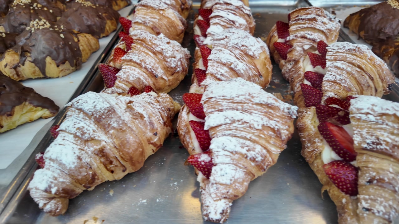 Freshly Baked Strawberry and Chocolate Croissants Dusted with Powdered Sugar