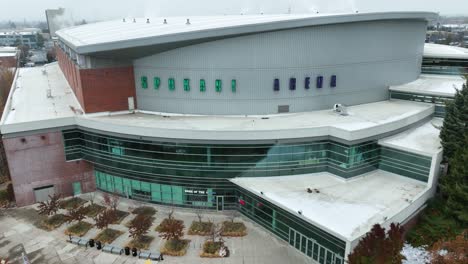 drone shot zooming out from the spokane arena sign to reveal how large the facility is