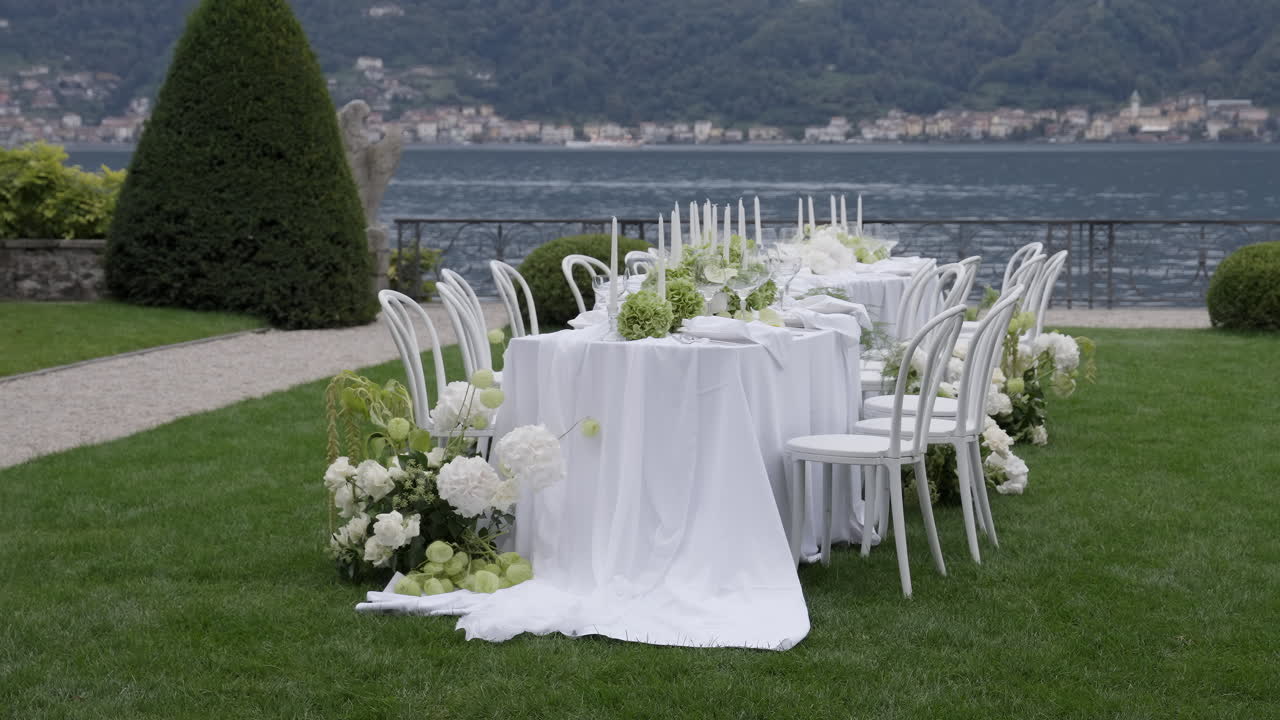 Elegant Outdoor Dining Table Setting with Lake View