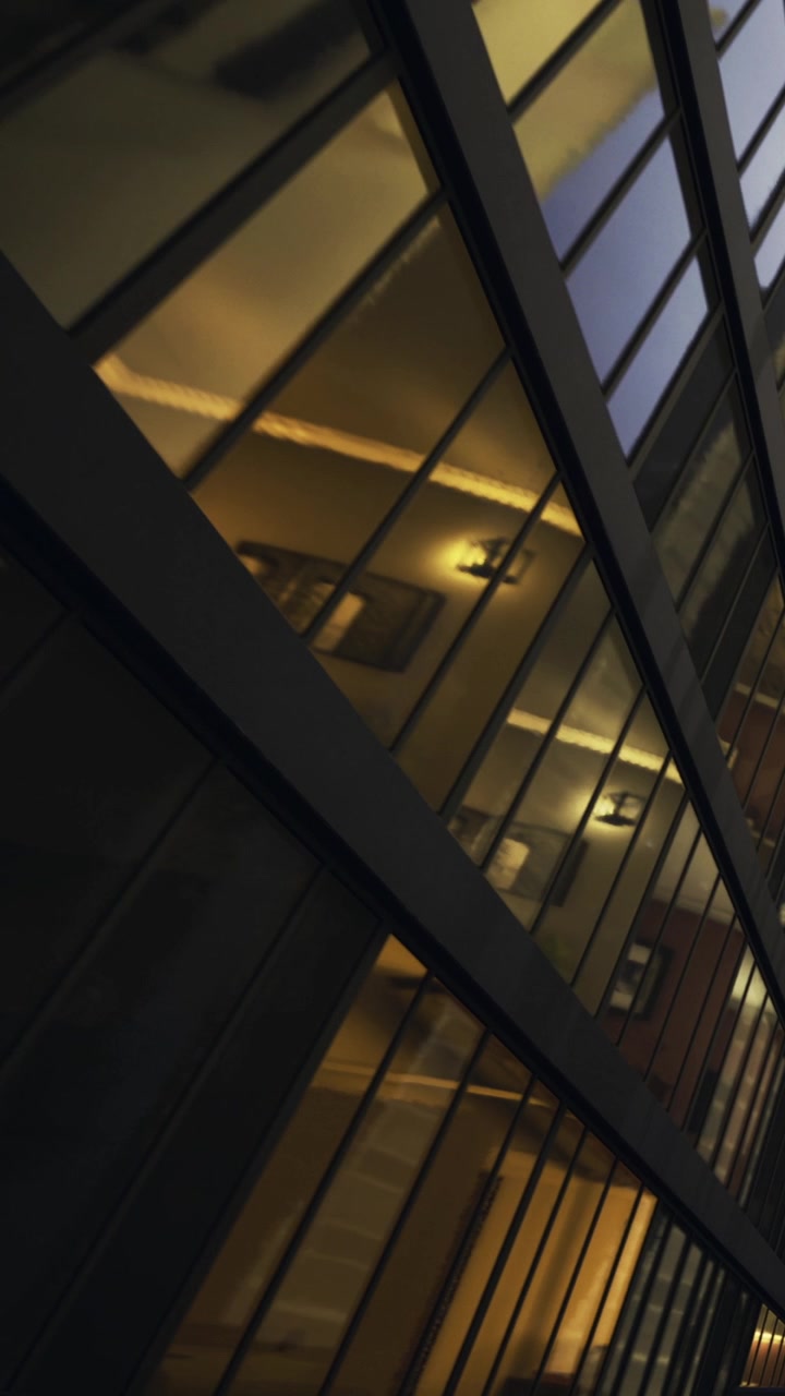 Reflections of a modern building at dusk in a city landscape