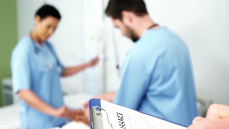 doctors treating a patient