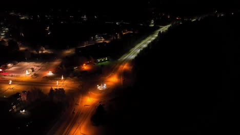 aerial view circling the roundabout in the salla town, winter night in lapland