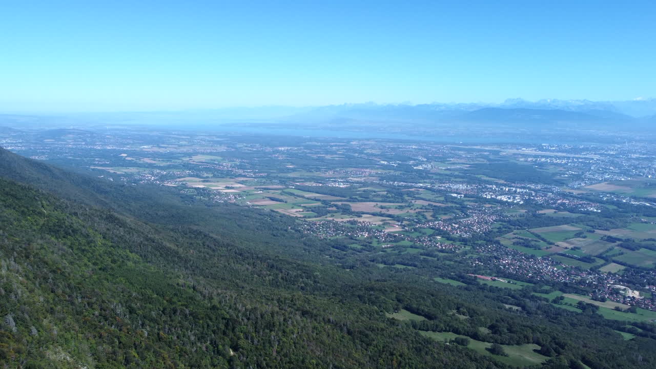 A Scenic Viewpoint Of Lake Geneva And The Alps From The Jura Mountain Range In Switzerland. Aerial Shot