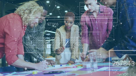 collaborating on animation project, diverse team using digital data in modern office