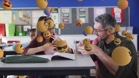 animation of emoji icons over diverse schoolgirl and teacher counting