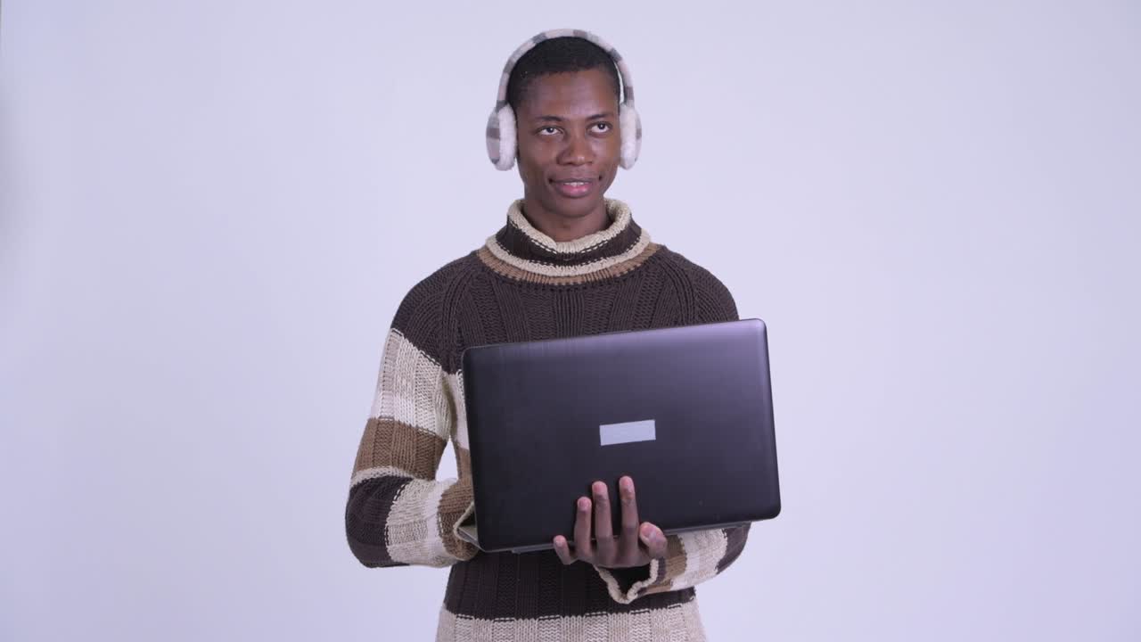Young handsome African man ready for winter