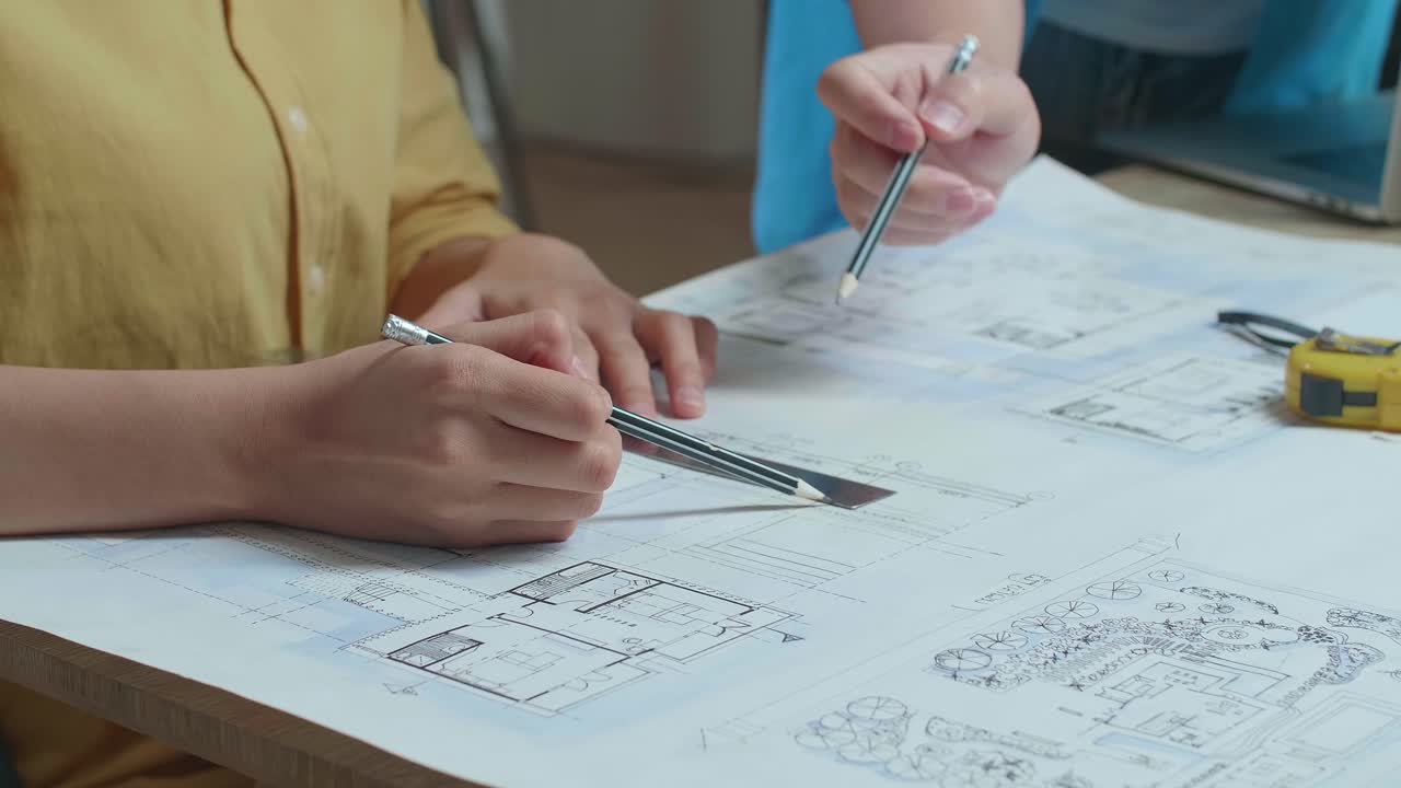 Close Up Of Hand'S Woman And Man Engineers With Blueprint Discuss About Design At The Office