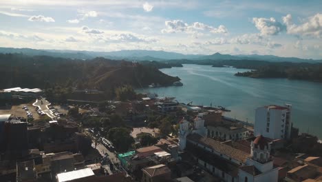 drone aerial view of town and the lake in el peñol, guatapé, medellin, colombia