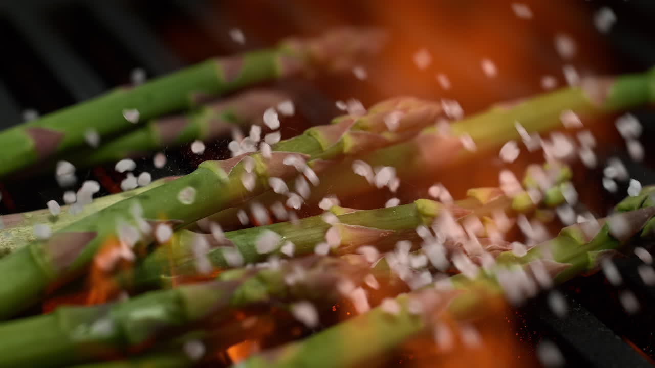 Asparagus On The Grill Seasoned With Coarse Salt, A Summer Vegetable BBQ in Macro and Slow Motion