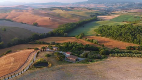 aerial wide shot surroundings of san quirico di orcia and val d'orcia in tuscany italy