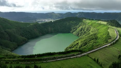 car drives road on rim of santiago crater lake at sete cidades