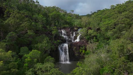 majestic waterfall cascading through lush green forest