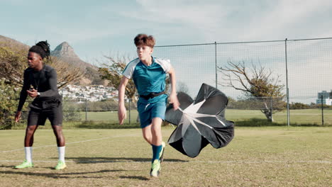 young athletes speed training with parachute
