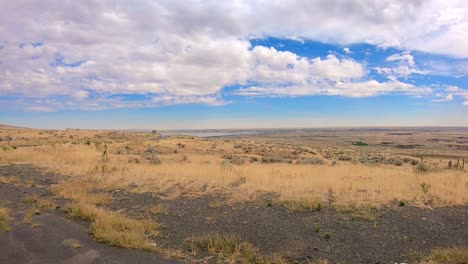 panoramic view of the okanogan highlands of north central washington state with traffic and columbia river in the background