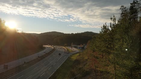 view from a bridge down to the german autobahn with many cars passing